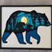 large bear with cubs and lights